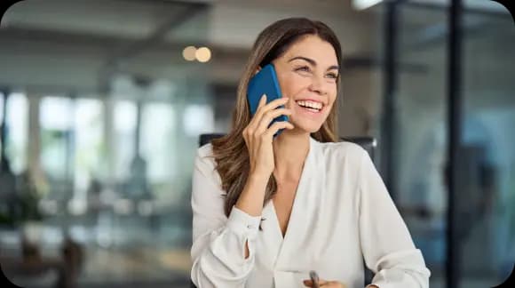 Woman smiling while talking on a smartphone